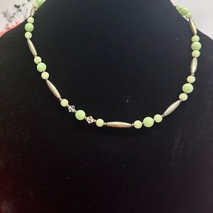 Silver tone necklace with green stone
